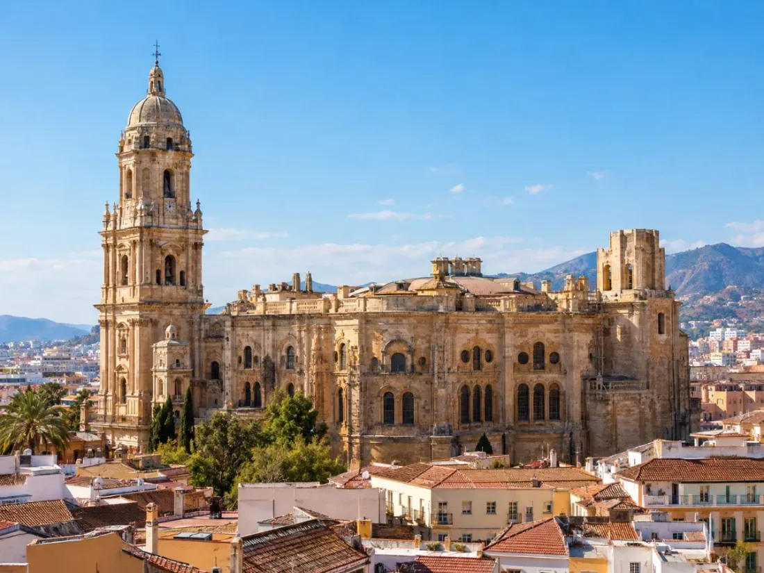 Málaga Cathedral with its single finished tower above the old town rooftops